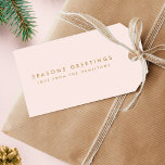 Modern Christmas | Blush Pink and Gold Minimal Gift Tags<br><div class="desc">Simple, stylish, trendy holiday gift tags with modern minimal typography quote "Seasons Greetings" in gold on a blush pink background. The name, year and greeting can be easily customized for a personal touch. A bold, minimalist and contemporary christmas design to stand out from the crowd this holiday season! #christmas #gifttags...</div>
