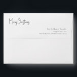 Modern Christmas Script Invitation Envelope<br><div class="desc">This modern Christmas script invitation envelope is perfect for your minimalist shabby chic boho black and white holiday greeting. The minimal whimsical handwritten calligraphy is delicate and rustic while staying classy and elegant. The design reflects a simple all-white winter day and evokes memories of a more simplistic life. You will...</div>
