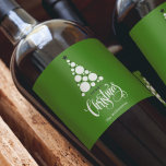 Modern Christmas Tree on Green Wine Label<br><div class="desc">Modern tree,  stars,  Merry Christmas and your names in chic lettering on a green background,  personalize these wine bottle labels to serve at your holiday party or to give as gifts or party favors for business gifts,  corporate gifts. CHANGE the background color to anything.</div>