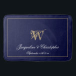 Modern Cute Blue Monogram Names Newlywed Wedding Bath Mat<br><div class="desc">Modern Cute Blue Monogram Names Newlywed Wedding Bath Mat. Chic stylish personalized navy blue and gold monogrammed bath mat. Classic script for the monogrammed last name initial, the names of the bride and groom and the date on a chic navy blue background. A perfect gift for newly weds, engaged couples...</div>