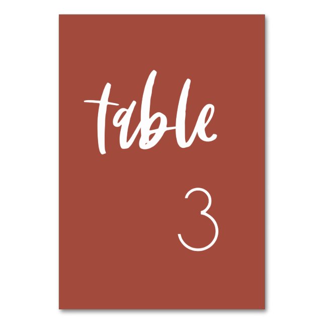 Modern elegant burnt brick wedding table number (Front)