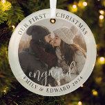 Modern Elegant First Christmas Engaged Photo Glass Ornament<br><div class="desc">Custom-designed photo ornament featuring "our first Christmas engaged" modern simple design with personalized photo,  name,  and year.</div>