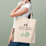 Modern Elegant Greenery Custom Name and Business Tote Bag<br><div class="desc">This stylish professional tote bag design is perfect for a small business owner or employee. Features the first and last name initials, the name in modern calligraphy script with classic and elegant text that can be personalized with a job title or business name, as well as a botanical greenery branch...</div>