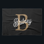 Modern Elegant Monogram Name  Black Gold Script  Kitchen Towel<br><div class="desc">The Modern Elegant Monogram Name Black Gold Script Kitchen Towel is a chic and functional accessory for any kitchen. It features a stylish black background with elegant gold script, customizable with a monogram and name, offering a personal touch. Made from high-quality, absorbent fabric, this kitchen towel is perfect for drying...</div>