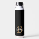 Modern Elegant Monogram Name Black Gold Script Water Bottle<br><div class="desc">The Modern Elegant Monogram Name Black Gold Script Water Bottle features a chic black design complemented by luxurious gold script. Personalization with a monogram and name adds a unique touch, making it both stylish and functional. Crafted from high-quality materials, it keeps beverages at the desired temperature while adding a sophisticated...</div>