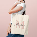 Modern Elegant Rose Gold Personalized Monogram Tote Bag<br><div class="desc">Modern and elegant tote bag features a simple and minimal custom rose gold and black (colours can be modified) personalized monogram design that can be personalized with an initial and name in script. Perfect gift for your wedding party - maid of honour, bridesmaids, mothers of the bride and groom, and...</div>