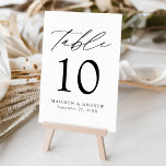 Modern Elegant Speckled White and Black Wedding Table Number<br><div class="desc">Trendy, minimalist wedding table number cards featuring black modern lettering with "Table" in modern calligraphy script. The design features a white background with subtle black specks for a unique design. The design repeats on the back. To order the table cards: add your name, wedding date, and table number. Add each...</div>