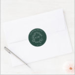 Modern Emerald Green Leafy Crest Monogram Wedding Classic Round Sticker<br><div class="desc">We're loving this trendy, modern emerald green wedding Envelope Seal! Simple, elegant, and oh-so-pretty, it features a hand drawn leafy wreath encircling a modern wedding monogram. It is personalized in elegant typography, Finally, it is trimmed in a delicate frame. View suite here: https://www.zazzle.com/collections/emerald_green_leafy_crest_monogram_wedding-119957580948924617 Contact designer for matching products to complete...</div>