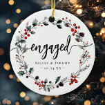 Modern Engagement First Christmas Mistletoe Wreath Ceramic Ornament<br><div class="desc">Celebrate your first Christmas engaged with this modern mistletoe wreath ornament! This ceramic keepsake brings festive charm to your tree. Personalize with custom text to make it uniquely yours. Makes a perfect gift for the couple to be :)</div>