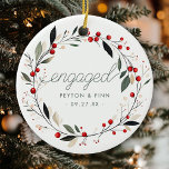 Modern First Christmas Engaged Mistletoe Wreath Ceramic Ornament<br><div class="desc">Celebrate your first Christmas engaged with this sweet,  modern mistletoe wreath ornament! This ceramic keepsake brings festive charm to your tree and makes a perfect gift for the couple to be. Personalize with your names and wedding date to make it uniquely yours.</div>