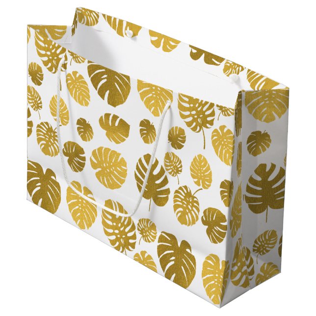 Modern Gold Monstera Tropical Leaves Pattern Large Gift Bag (Front Angled)