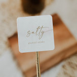 Modern Gold Script Salty Wedding Favour Square Sticker<br><div class="desc">These modern gold script salty wedding favour stickers are perfect for a minimalist wedding. The simple yellow gold colour design features unique industrial lettering typography with modern boho style. Customizable in any colour. Keep the design minimal and elegant, as is, or personalize it by adding your own graphics and artwork....</div>