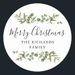 Modern Greenery Merry Christmas Family Name Classic Round Sticker<br><div class="desc">Watercolor greenery frames elegant script Merry Christmas typography on these elegant holiday stickers. Personalise with your family name. Designed by Thisisnotme©</div>