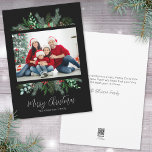 Modern Greenery Photo Merry Christmas Holiday Card<br><div class="desc">A simple and classic Christmas card look with greenery like evergreen branches, leaves, and more surround a single photo of your family or whatever you want to include. A black background gives this a modern vibe. Subtle hints and pops of colour from the red holly berries give it a little...</div>