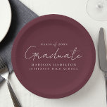 Modern Handwritten Script Maroon Graduation Paper Plate<br><div class="desc">Elevate your graduation party decor with our stylish graduation paper plates! Featuring a chic handwritten white script and a maroon background, these paper plates add a touch of sophistication to your celebration. Personalize them with the graduate's name, graduation year, and school name. Whether you're serving snacks or drinks, these plates...</div>