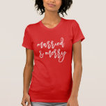 Modern Married and Merry Script Newlywed Christmas T-Shirt<br><div class="desc">Celebrate being a newlywed for your first Christmas with our cute and festive "Married and Merry" holiday t-shirt. The shirt features the phrase "Married and Merry" displayed in a handwritten white script on a red t-shirt or colour of your choice. Personalize the Married and Merry t-shirt with custom text and/or...</div>