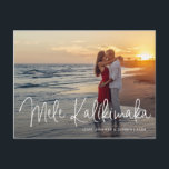 Modern Mele Kalikimaka Beach Photo Christmas Holiday Postcard<br><div class="desc">Send out holiday cheer with this modern Christmas postcard featuring a simple design with the Hawaiian greeting "Mele Kalikimaka" in an elegant thin white script,  along with your names and year over your favourite photo.  The backside has your personal message and your return address for easy mailing.</div>