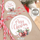 Modern Merry Christmas Script Red Bow From Name Classic Round Sticker<br><div class="desc">Add a special touch to your Christmas gifts with these personalized FROM stickers featuring MERRY CHRISTMAS in modern calligraphy script typography accented with a watercolor red bow and holly. ASSISTANCE: For help with design modification or personalization, resizing, transferring the design to another product or if you would like coordinating items,...</div>