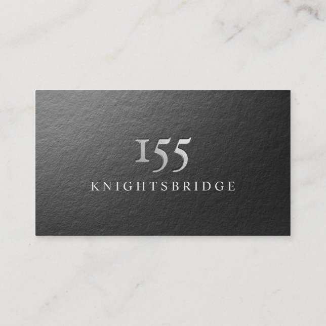 Modern Minimal Black and Silver Foil Debossed Logo Business Card (Back)