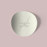 Modern Minimal Elegant Script Monogram Wedding Classic Round Sticker<br><div class="desc">Modern Minimal Elegant Script Monogram Wedding Classic Round Sticker Add a touch of elegance to your wedding with these modern, minimalist, and elegant script monogram classic round stickers. Crafted in classic ivory and storm dust colours, these stickers are perfect for sealing invitations, favour bags, or adding a personalized touch to...</div>