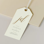 Modern Minimal Elegant Script Monogram Wedding Gift Tags<br><div class="desc">Modern Minimal Elegant Calligraphy Script Monogram Wedding Gift Tags Add a touch of elegance to your wedding favours with these stunning, modern, minimalist, and elegant calligraphy script monogram gift tags. Crafted in classic ivory, Storm Dust and gold, these tags are the perfect way to personalize your gifts and thank your...</div>