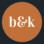 Modern Minimal Monogram Initials Orange Wedding Cl Classic Round Sticker<br><div class="desc">Modern,  minimal,  minimalist wedding design with big bold letters in orange tone colour: Burnt Orange (colour,  font,  text,  size can be changed).  With date and bride and groom monograms (initials).  Stickers / seals for wedding invitation envelopes. Perfect for that young couple for fall/autumn wedding.</div>