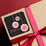 Modern Minimal Nordic Black Red White Christmas Square Sticker<br><div class="desc">Add a touch of holiday magic to your gifts or cards with this customizable Christmas sticker. The design features a trio of red and white snowflakes, each unique in size and pattern, suspended from white strings against a striking black background. The words "Merry Christmas" are elegantly scripted in a combination...</div>