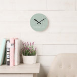 Modern Minimal Sage Green Personalized Name Round Clock<br><div class="desc">Add a touch of timeless elegance to your space with our Modern Minimal Sage Green Personalized Wall Clock. Crafted with simplicity and sophistication in mind, this sleek timepiece is customizable to reflect your unique style. Perfect for any room, it effortlessly blends contemporary design with understated charm.</div>