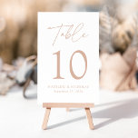 Modern Minimalist Blush Script Wedding Table Number<br><div class="desc">Elegant wedding table number card displaying the word "Table" in a blush handwritten script with the table number, your names, and wedding date shown below with a white background. The design repeats on the back. To order the table number cards, simply type each number and add it to your cart....</div>