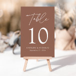 Modern Minimalist Brown Clay Wedding Table Number<br><div class="desc">Elegant wedding table number card displaying the word "Table" in a white handwritten script with the table number, your names, and wedding date shown below with a brown background. The design repeats on the back. To order the table number cards, simply type each number and add it to your cart....</div>