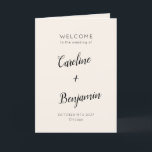 Modern Minimalist Ivory Cream Black Wedding Program<br><div class="desc">Welcome guests to your wedding day with this beautifully designed ivory cream and black folded program that combines simplicity and sophistication. The elegant cover features customizable names and event details in graceful typography, while the inside includes a preformatted template to outline your ceremony and wedding party details. The back is...</div>