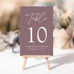 Modern Minimalist Mauve Purple Wedding Table Number<br><div class="desc">Elegant wedding table number card displaying the word "Table" in a white handwritten script with the table number, your names, and wedding date shown below with a mauve purple background. The design repeats on the back. To order the table number cards, simply type each number and add it to your...</div>