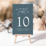 Modern Minimalist Smoky Blue Wedding Table Number<br><div class="desc">Elegant wedding table number card displaying the word "Table" in a white handwritten script with the table number, your names, and wedding date shown below with a smoky blue background. The design repeats on the back. To order the table number cards, simply type each number and add it to your...</div>