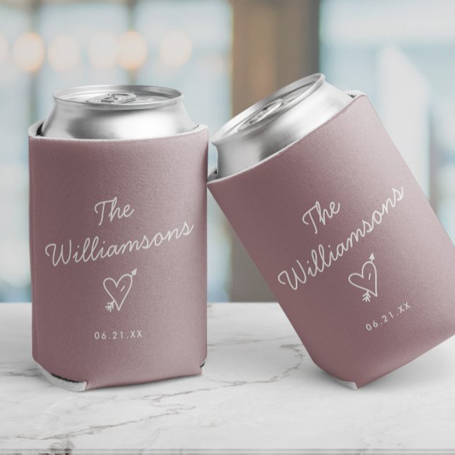 Modern Minimalist Wedding Simple Last Name Can Cooler (Blush pink can coolers with custom date and name, as well as a cupids heart illustration, minimalist)