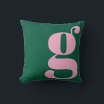 Modern Monogram Initial Letter Preppy Pink Green Throw Pillow<br><div class="desc">This preppy monogram pillow features an oversized lowercase initial in pink against a deep green background. The bold, modern letterform adds personality and charm to teen rooms, dorms, and cozy spaces. Its clean, stylish look makes it easy to mix with colorful decor or classic prep accents. A fun, expressive design...</div>