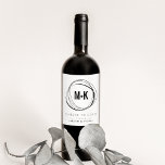 Modern Monogram Wedding Favor Wine Labels<br><div class="desc">Modern, striking and elegant wine labels are a perfect way to personalize your wine wedding favors. Chic black and white design features your initials joined in modern style by a plus sign, framed by an abstract circular border. Personalize with your custom message (shown with "cheers to love"), wedding date and...</div>