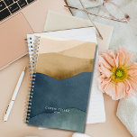 Modern Mountains | Watercolor Paper Landscape Planner<br><div class="desc">Stay organized and inspired with our customizable planner featuring a modern mountains design with subtle watercolor paper-layered on both the front and back covers. Personalize it with your name and the year for a planner that's uniquely yours. With ample space for scheduling, note-taking, and goal-setting, this planner is subtlety elegant...</div>