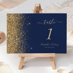 Modern Navy Blue Gold Glitter Edge Wedding Table Number<br><div class="desc">The left-hand edge of this elegant modern wedding table number features a gold faux glitter design. The customizable text combines pale gold-coloured handwriting,  copperplate and italic fonts on a navy blue background.</div>