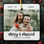 Modern Newlywed Merry and Married Photo Christmas Ceramic Ornament<br><div class="desc">A simple Merry & Married Christmas ornament with script typography and your photo. Personalize it with your name,  wedding date and photo. Back of ornament has a simple black and white plaid pattern. Designed for you by Blackberry Boulevard.</div>