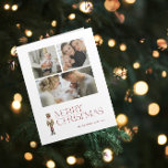 Modern Nutcracker Merry Christmas 3 Family Photo Card<br><div class="desc">Celebrate the holiday season with the Modern Nutcracker Merry Christmas 3 Photo Typography Card! This stunning card features a beautiful watercolor nutcracker set against a backdrop of festive typography in a rich burgundy hue. Personalize your 3 family photos and family name to make your card truly unique. Upon opening the...</div>