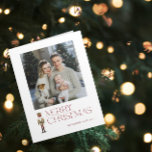 Modern Nutcracker Merry Christmas Family Photo Card<br><div class="desc">Celebrate the holiday season with the Modern Nutcracker Merry Christmas Photo Typography Card! This stunning card features a beautiful watercolor nutcracker set against a backdrop of festive typography in a rich burgundy hue. Personalize your family photo and family name to make your card truly unique. Upon opening the card, traditional...</div>