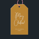 Modern Ochre Calligraphy Script Merry Christmas Gift Tags<br><div class="desc">Modern Christmas gift tag with contemporary calligraphy for "Merry Christmas" on ochre golden background and your family name or other text of choice. This style matches the Christmas wrapping paper in my shop.</div>