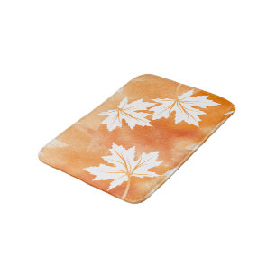 Modern orange watercolor and white maple leaves bath mat