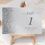 Modern Pale Grey Silver Glitter Edge Wedding Table Number<br><div class="desc">The left-hand edge of this elegant modern wedding table number features a silver faux glitter design. The customizable text combines charcoal grey handwriting,  copperplate and italic fonts on a pale grey background.</div>