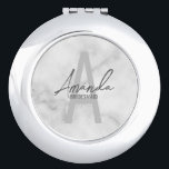 Modern Personalized Bridesmaid's Monogram and Name Compact Mirror<br><div class="desc">Modern Personalized Bridesmaid's Monogram and Name Gifts This design features personalized bridesmaid's name in grey modern handwriting script font style and monogram in light grey modern sans serif font style as background, with wedding details in grey modern sans serif font style, on white marble background. Also perfect for maid of...</div>
