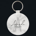 Modern Personalized Bridesmaid's Monogram and Name Keychain<br><div class="desc">Modern Personalized Bridesmaid's Monogram and Name Gifts This design features personalized bridesmaid's name in grey modern handwriting script font style and monogram in light grey modern sans serif font style as background, with wedding details in grey modern sans serif font style, on white marble background. Also perfect for maid of...</div>