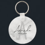 Modern Personalized Bridesmaid's Monogram and Name Keychain<br><div class="desc">Modern Personalized Bridesmaid's Monogram and Name Gifts This design features personalized bridesmaid's name in grey modern handwriting script font style and monogram in light grey modern sans serif font style as background, with wedding details in grey modern sans serif font style, on white marble background. Also perfect for maid of...</div>