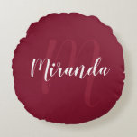 Modern Personalized Monogram and Name Burgundy Red Round Pillow<br><div class="desc">Personalized Monogram and Name Gift featuring personalized name in white modern script font style and monogram in light burgundy red modern script font style as background on burgundy red background. Perfect as holiday gift, family reunion favours, housewarming gift, wedding gift, thank you gift for bridesmaids and gift for any special...</div>