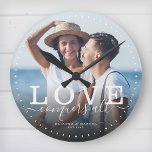 Modern Quote Love Wedding Photo Newlywed Script Round Clock<br><div class="desc">Custom modern chic photo clock with hand-lettered script and modern typography reading:' Love conquers all ' alongside your custom names and wedding date. Personalize with your favourite photo and information. Great gift for newlyweds,  an anniversary or Valentine's Day!</div>