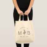 Modern Rustic Floral Stem Wedding Monogram Tote Bag<br><div class="desc">Custom printed tote bags make a fun and functional wedding favour your guests will love! Personalize the template with the bride and groom's names or monogram initials. Add your wedding date, the city, state or venue name or any other custom text. This modern rustic logo-style design has a simple floral...</div>